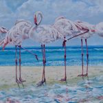 Clickable photograph of an original oil painting, on ply board, depicting 8 wading and standing pink flamingos on a strip of sand. Foreground shows reflections of the birds in the water. The background suggests a tranquil bay, with palm trees. Some of the flamingos are dipping their heads towards the shallow lapping sea. In the distance, a wave can be seen breaking.