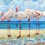 Clickable photograph of an original oil painting, on ply board, depicting 8 wading and standing pink flamingos on a strip of sand. Foreground shows reflections of the birds in the water. The background suggests a tranquil bay, with palm trees. Some of the flamingoes are dipping their heads towards the shallow lapping sea. In the distance, a wave can be seen breaking.